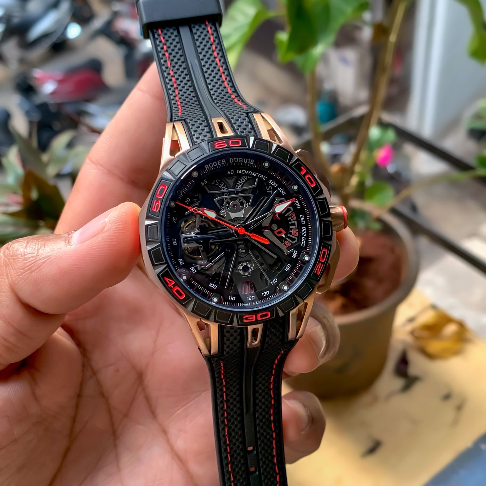 Roger Dubuis Excalibur Spider watch with a rose gold case and a black rubber strap